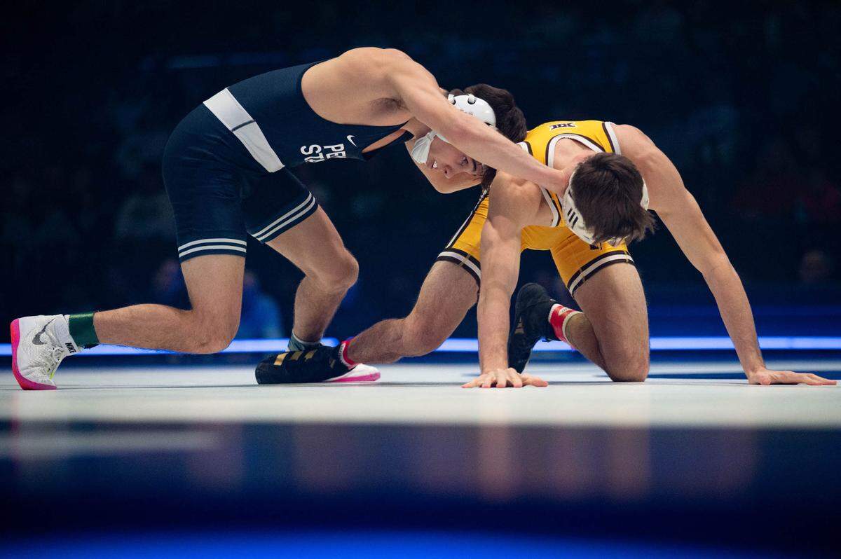 At 125, Luke Lilledahl, left, wrestles Jack Braman, right, during the dual meet between Penn State and Wyoming on Sunday, Dec. 15, 2024.