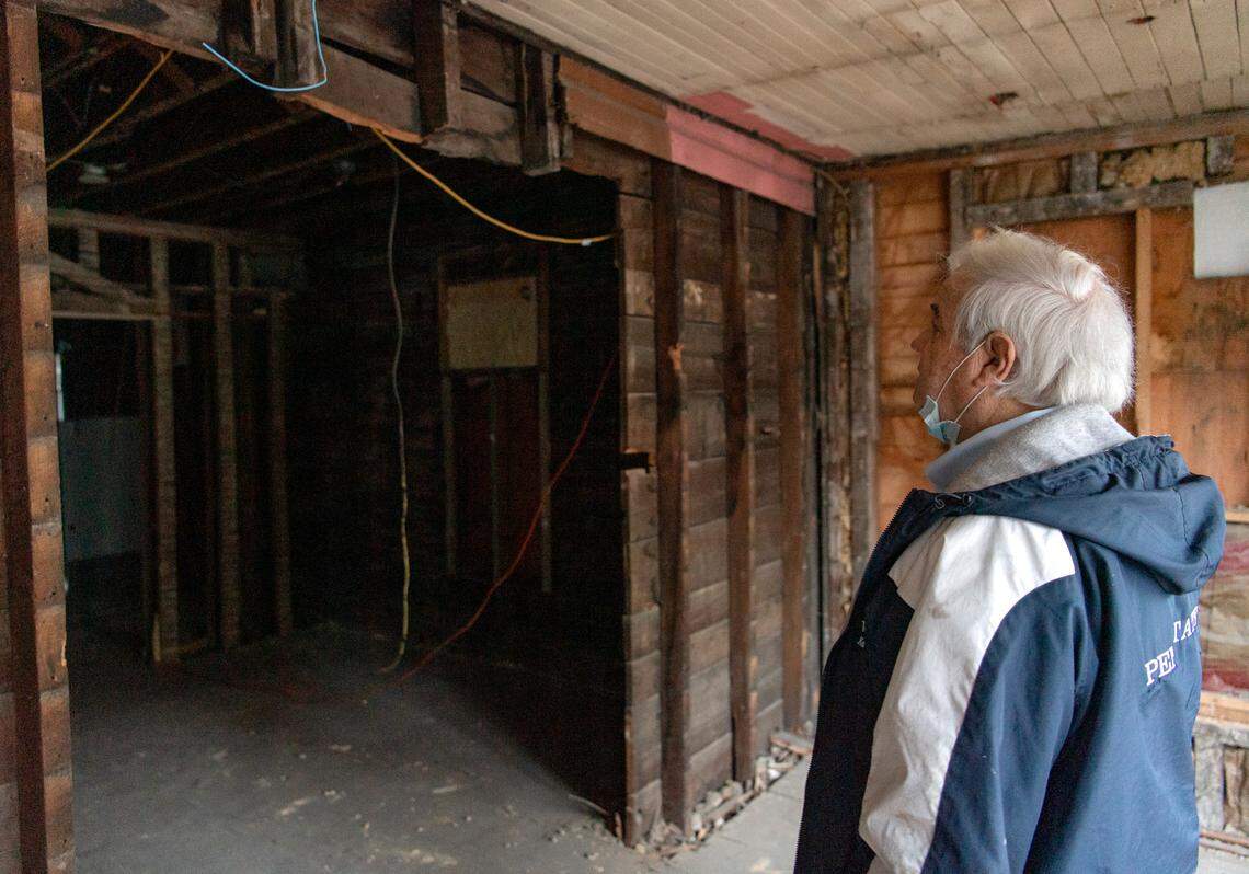 Pat Daugherty looks at the demolition that is happening in the “Old Main room” at The Tavern on Tuesday Jan. 5, 2021. The room has a large window with a view of Old Main and has hosted many wedding rehearsal dinners.