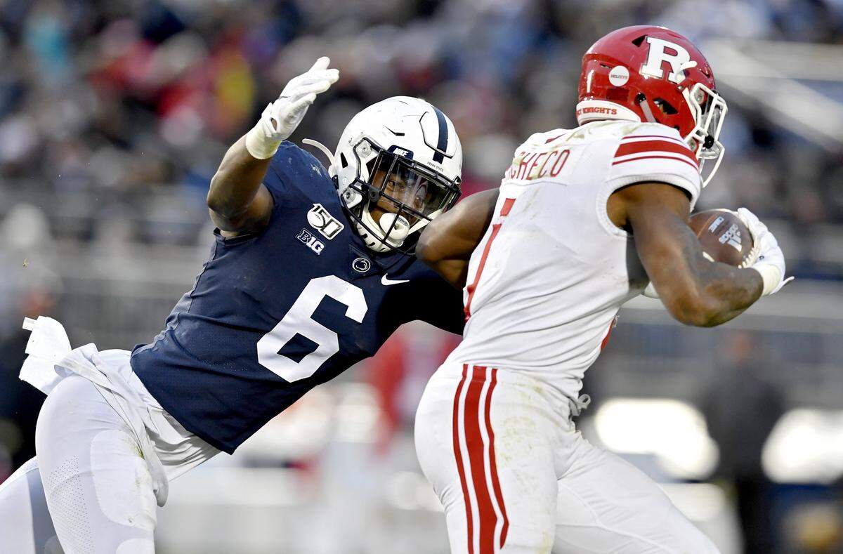 Penn State linebacker Cam Brown reaches to stop Rutgers running back Isaih Pacheco during the game on Saturday, Nov. 30, 2019.