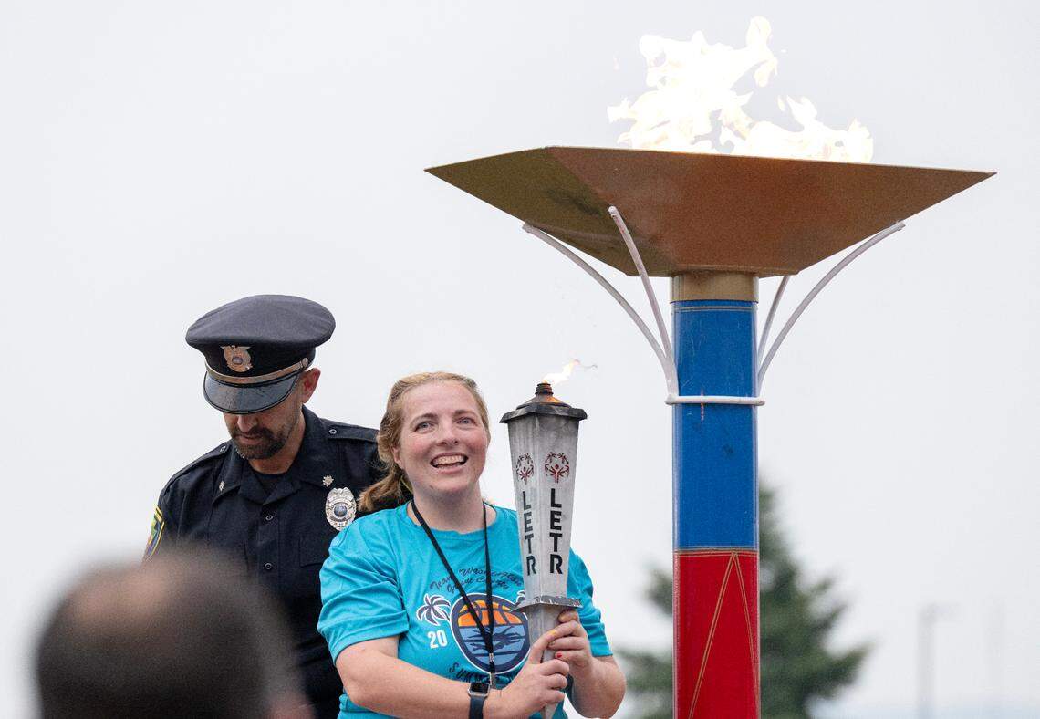 Three River Region athlete Nancy Grimm and Monroeville Police Department Officer Pierre DeFelice light the cauldron for the Special Olympics PA Summer Games on Thursday, June 5, 2025.