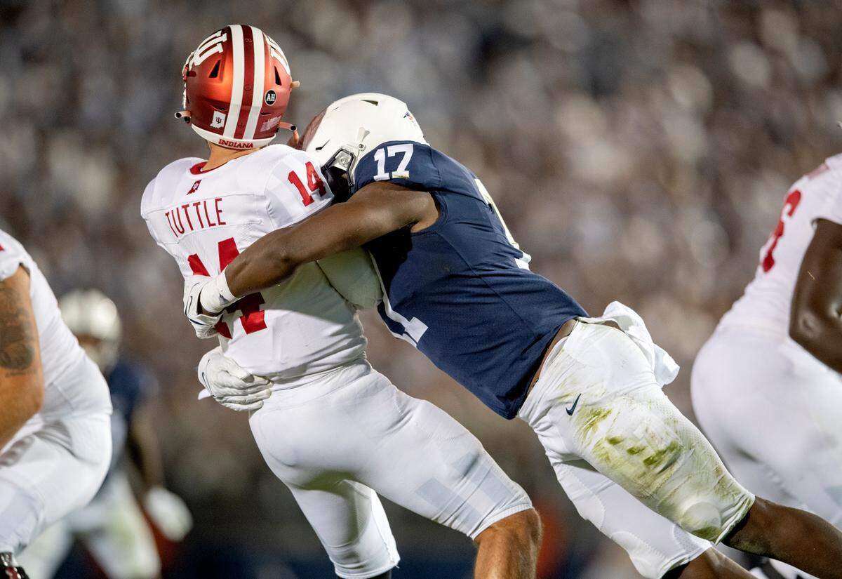 Penn State defensive end Arnold Ebiketie sacks Indiana quarterback Jack Tuttle on his first play in the game.