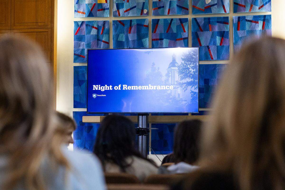 A screen sits at the front of Eisenhower Chapel during the Night of Remembrance inside the Pasquerilla Spiritual Center on Thursday, April 30, 2026. The event was hosted by student government organizations in honor of Penn State students and faculty who died during the 2025-26 school year.