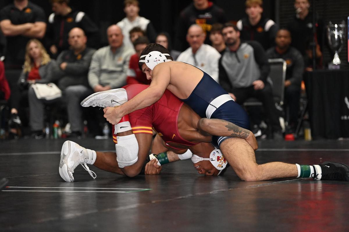 Penn State’s Alex Facundo attempts to stop Iowa State’s David Carr from taking him down in their 165-pound match of the Nittany Lions’ 22-12 win on Tuesday, Dec. 20, 2022. Carr topped Facundo, 4-2.