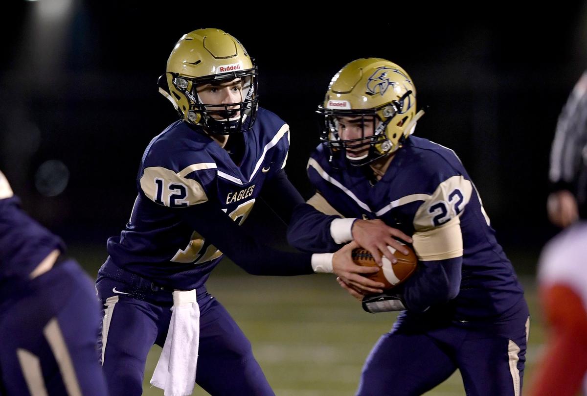 Bald Eagle Area’s Jaden Jones hands off Gage McClenahan during the District 6 playoff game against Central on Friday, Nov. 1, 2019.
