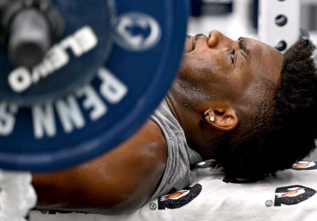 Penn state defensive end Dani Dennis-Sutton bench presses during a summer strength session on Monday, July 14, 2025 in the Lasch Building.