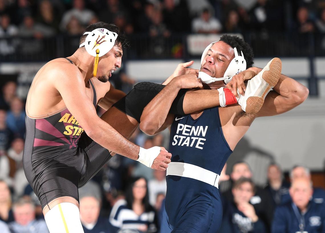 Penn State’s Mark Hall, 174 lbs, (right) lifts Arizona State’s Zahid Valencia off the mat Friday at Rec Hall in State College. Hall, ranked #2 in the nation defeated #1 Valencia, 4-0. Penn State defeated Arizona State, 41-3. (For the CDT/Steve Manuel)