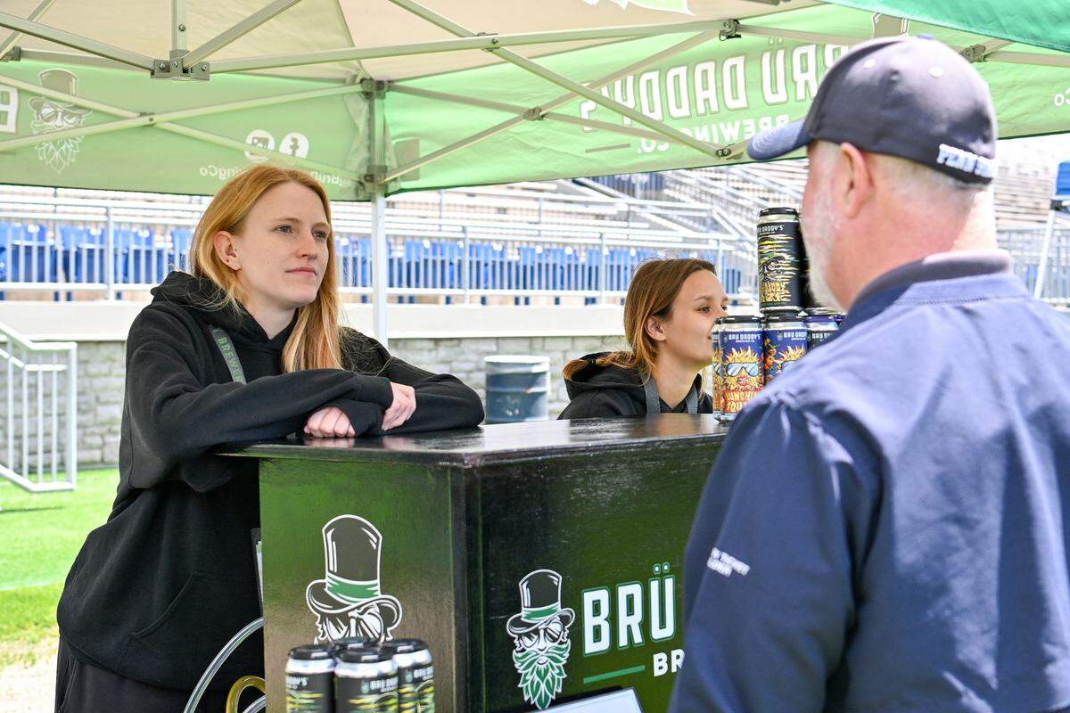 A representative from Brü Daddy’s Brewing Company in Allentown talks to an attendee during the Hoppy Valley Brewers Fest on Saturday at Penn State’s Beaver Stadium.