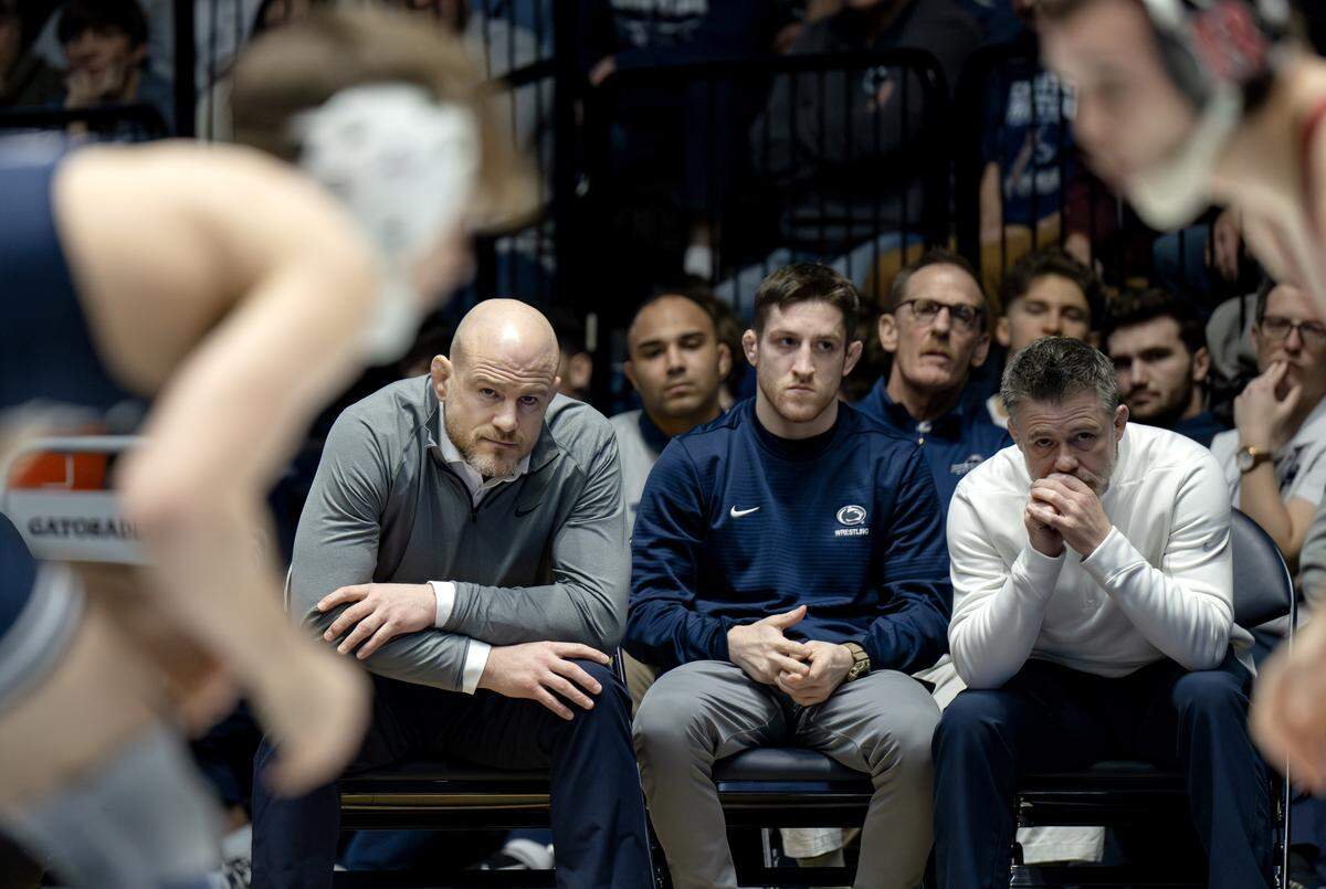 Penn State wrestling coaches Cael Sanderson, Nick Lee and Cody Sanderson watch Marcus Blaze in his 133 lb bout of the match on Saturday, Jan. 10, 2026 in Rec Hall.