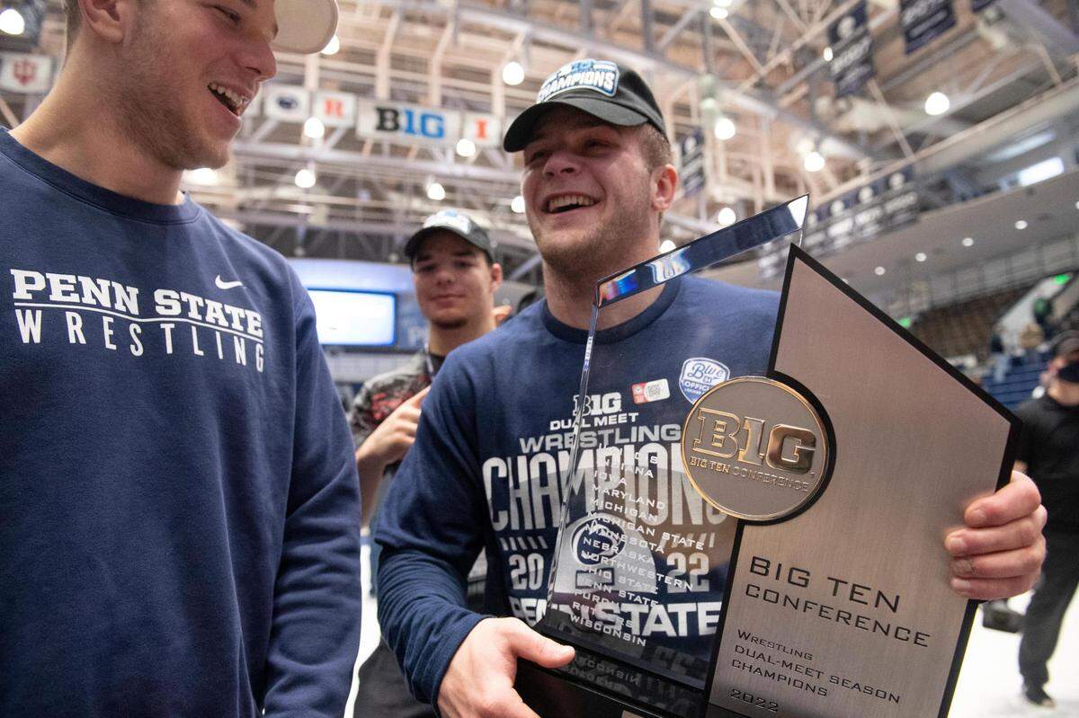 A member of Penn State’s wrestling team holds the Big Ten Regular Season Dual Meet Championship trophy after an NCAA wrestling dual between No. 1 Penn State and No. 8 Nebraska at Rec Hall on Sunday. Penn State defeated Nebraska 21-13 and claimed the Big Ten Regular Season Dual Meet Championship.