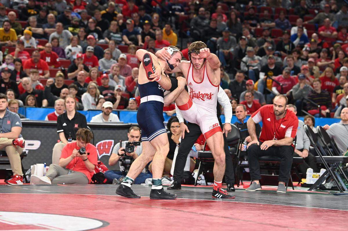 Penn State’s Max Dean aims to earn a takedown on Nebraska’s Eric Schultz in their 197-pound finals match of the Big Ten Championships on Sunday, March 6, 2022 in Lincoln, Neb. Dean earned his first Big Ten title by beating Schultz, 4-2.
