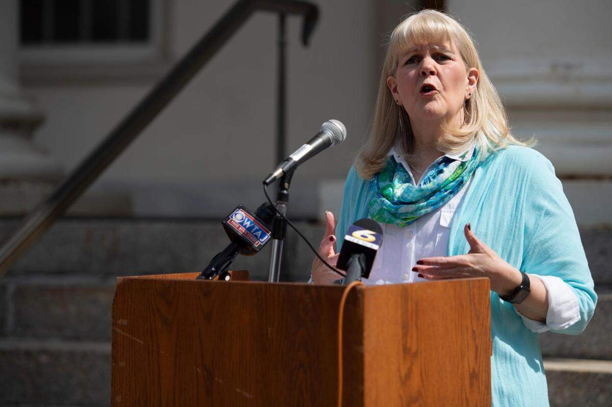 Centre Safe Executive Director Anne Ard speaks during Centre Safe’s Day of Action recognizing April as Sexual Assault Awareness and Child Abuse Prevention Month at the Centre County Courthouse on Tuesday, April 5, 2022 in Bellefonte.