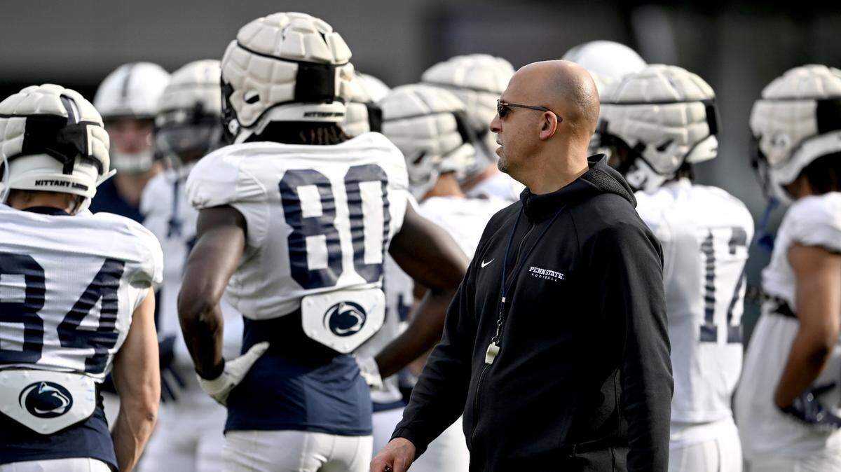 Penn State football coach James Franklin walks around the wide receivers as they get instructions during practice on Tuesday, April 11, 2023.