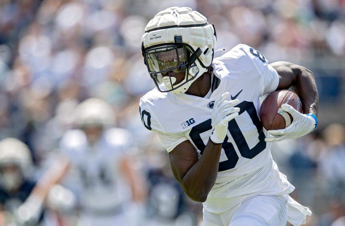 Penn State wide receiver Malick Meiga makes a catch and runs during the Blue-White game on Saturday, April 23, 2022.