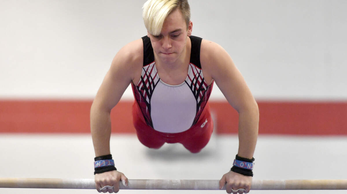 Bellefonte’s Tyler Muse competes on the bars during the gymnastics meet against Altoona on Tuesday, Dec. 11, 2018.