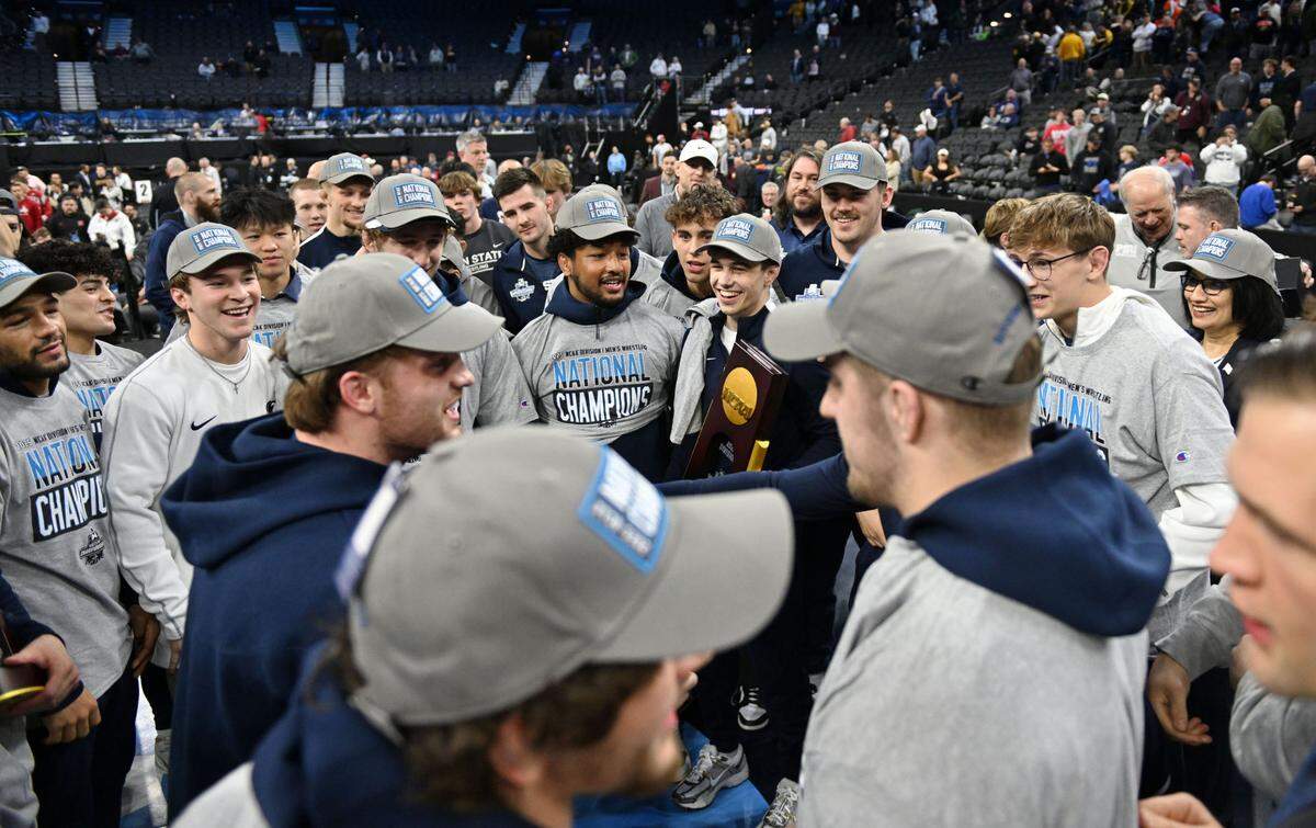 Penn State wrestling celebrates winning the team title at the 2025 NCAA Wrestling Championships at the Wells Fargo Center in Philadelphia on Saturday March 22, 2025.  