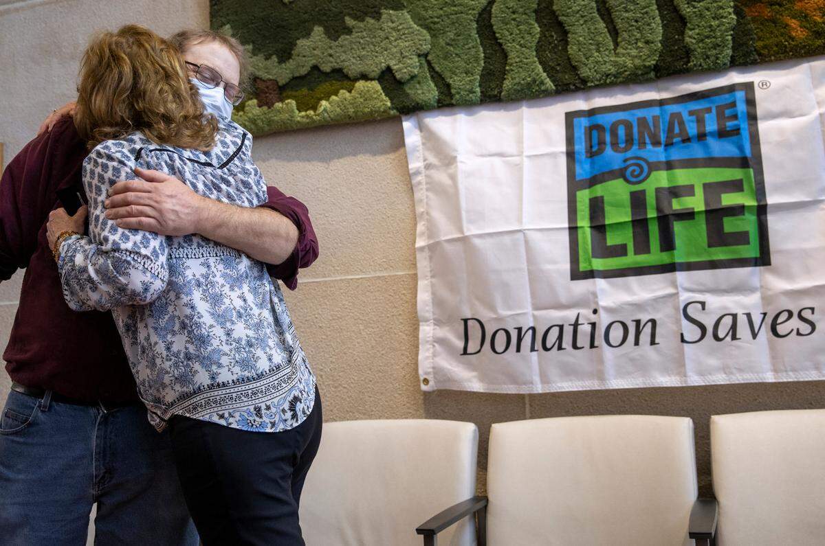 Dwayne Weller, left, and Maureen Stathes meet for the first time in the lobby of Penn State Health Milton S. Hershey Medical Center on April 6. Stathes donated a kidney to Weller and they met to help celebrate National Donate Life Month.