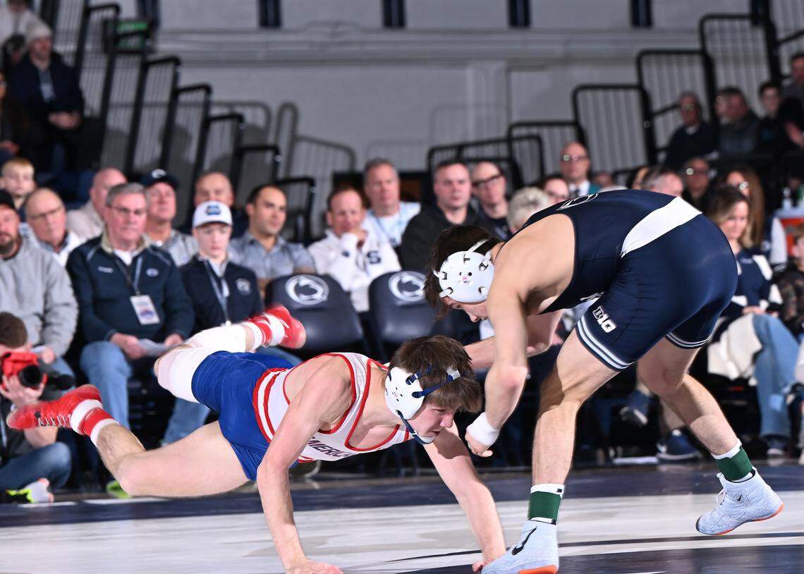 American’s Coen Bainey, left, spins free from Penn State’s Luke Lilledahl at 125 lbs during the Friday, Feb. 21 match at Rec Hall. Lilledahl won in a tech fall. Penn State defeated American University, 50-3.