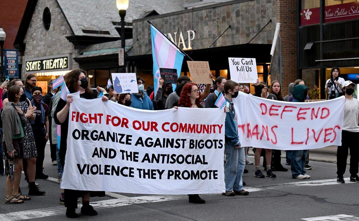A group from Central PA Trans United stopped traffic as they marched on College Avenue on Monday, March 31, 2025.