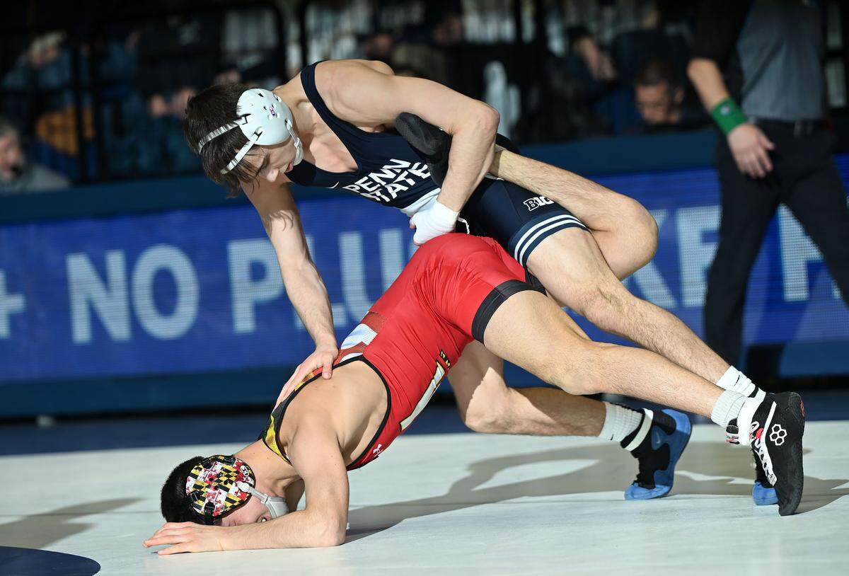 Penn State’s Luke Lilledahl takes down Maryland’s Tyler Garvin at 125 lbs. during Sunday’s meeting at Rec Hall in State College. Lilledahl defeated Garvin, 19-4.