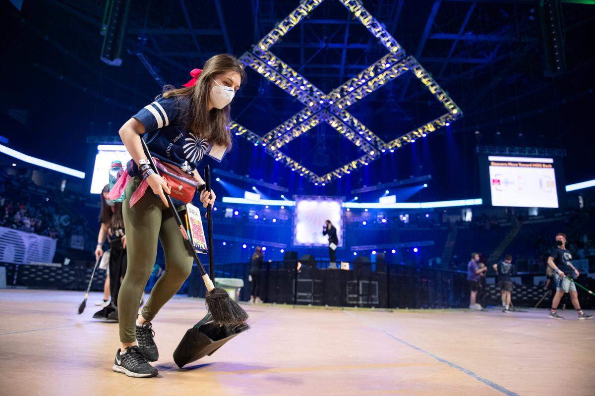A Thon volunteer sweeps the floor of the Bryce Jordan Center on Saturday.