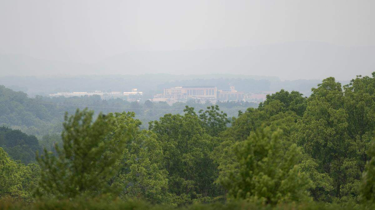 Mount Nittany Medical Center is seen through smokey skies from Oak Hall Regional Park on Wednesday, June 7, 2023.  
