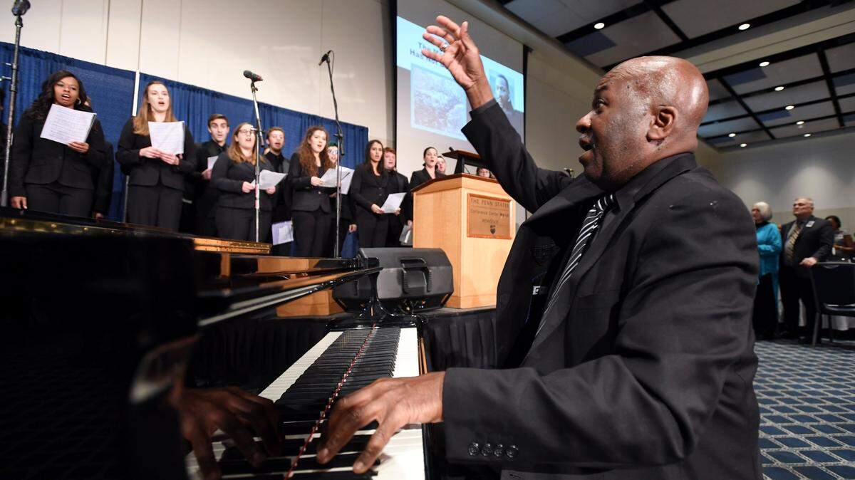 Dr. Tony Leach leads Essence of Joy as they perform atthe 43rd Annual Dr. Martin Luther King Jr. Memorial Banquet Monday, Jan. 15, 2018 at the Penn Stater.