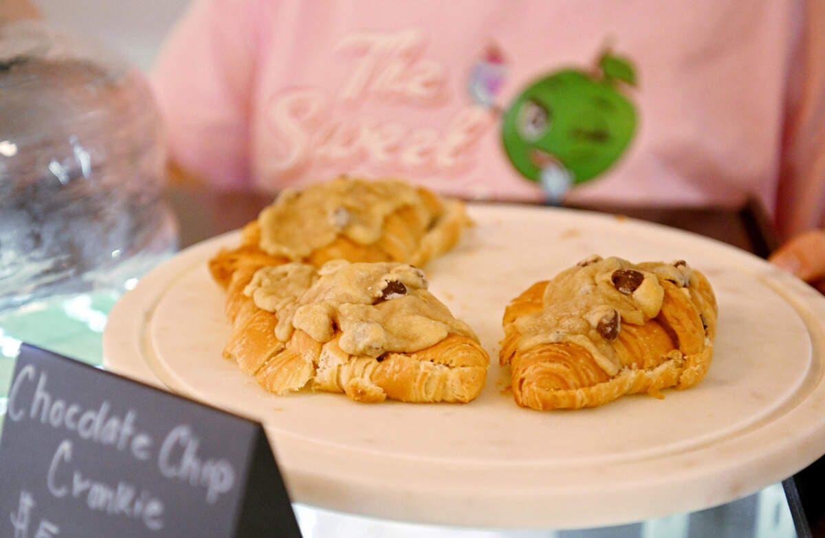 Mae Kopchik of Mae’s Makin’s shows off one of her new treats, the “chocolate chip cronkie,” at Sweet Suite at 119 N. Front St. in Philipsburg on Wednesday, March 27, 2024.