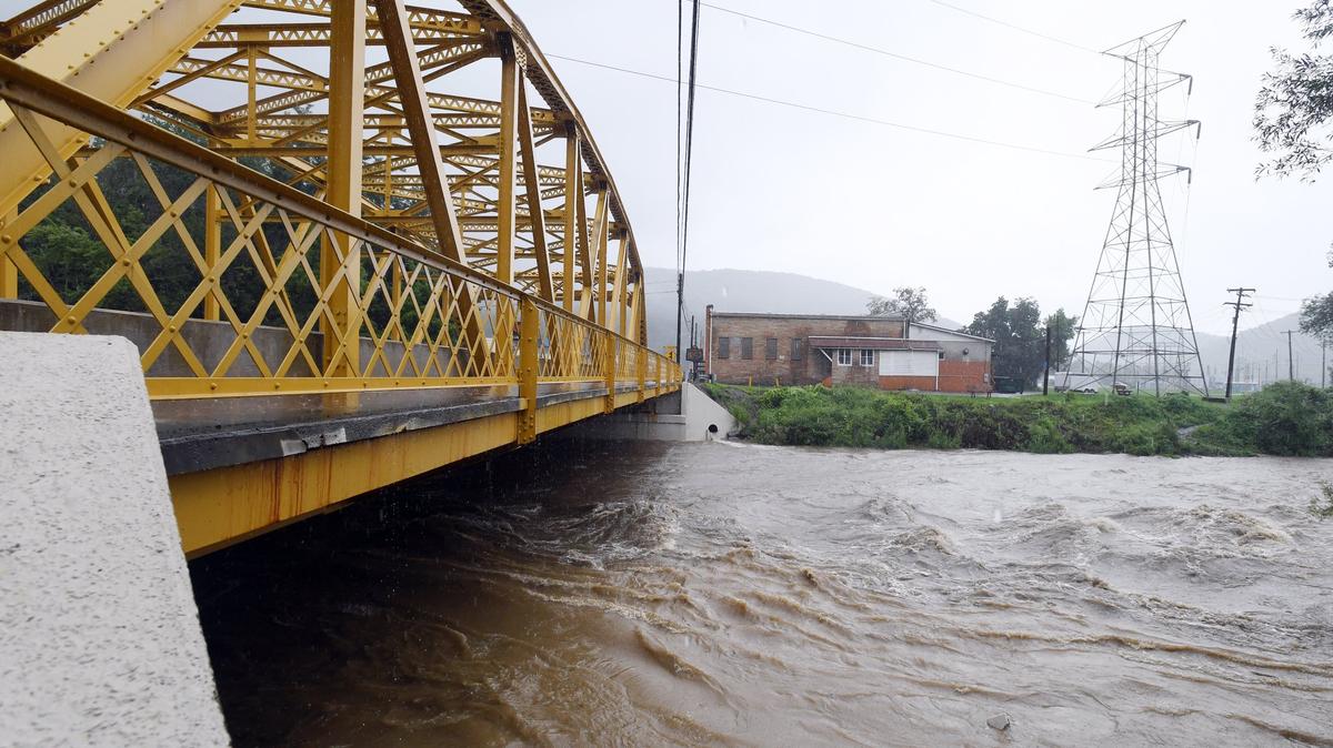 Bald Eagle Creek water levels are high after rainfall Friday, Aug 3, 2018 at the Milesburg Bridge.