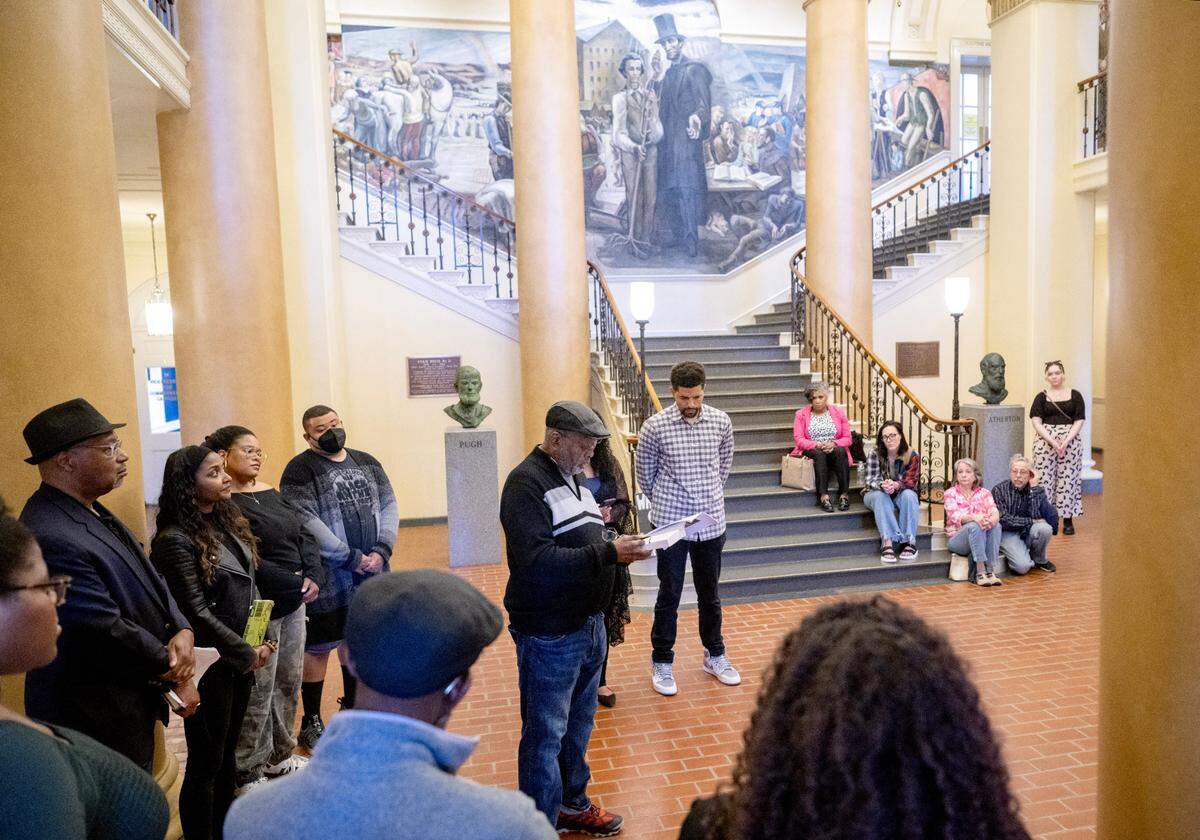 Darryl Thomas reads to the crowd during the third read-in for racial justice of the spring semester inside Penn State’s Old Main on Tuesday, April 16, 2024. After the read-in a letter was delivered to the office of President Neeli Bendapudi.