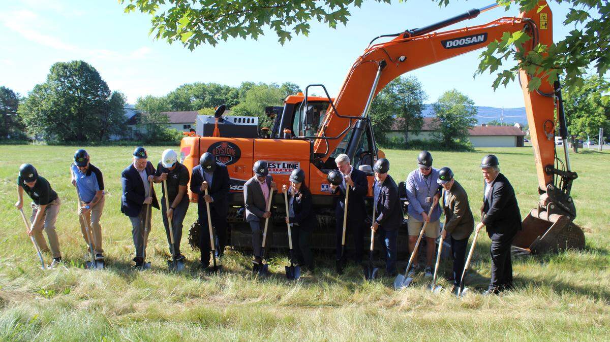 A group of stakeholders break ground Friday on the IHG’s new dual brand hotel on Benner Pike. From left: PennTerra Engineering’s John Sepp, Thomas Crissinger of Mifflinburg Bank and Trust, IHG Regional Director David Greenwood, Ken Weaver of Weaver Construction, hotel developers Mike and Arun Patel, County Commissioner Amber Concepcion, CBICC President Greg Scott, Centre County Commissioner Mark Higgins, Bellefonte Mayor Buddy Johnson, Bellefonte Borough Manager Ralph Stewart and HVAB President Fritz Smith.