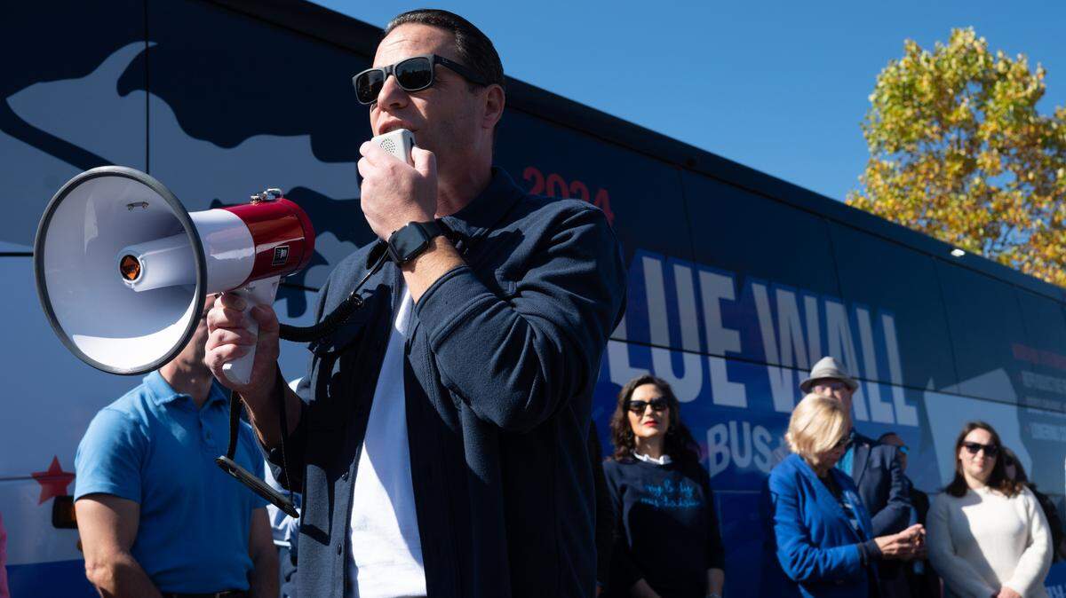 Pennsylvania Gov. Josh Shapiro speaks to attendees during the “Driving Forward Blue Wall Bus Tour” in State College on Sunday, Oct. 20, 2024.