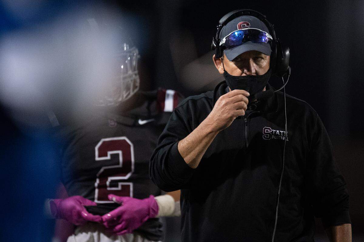 State College head coach Matt Lintal talks into his headset during the District 6 Title Game were State College faced Altoona, on Friday, 23, 2020 at Mansion Park Stadium in Altoona.