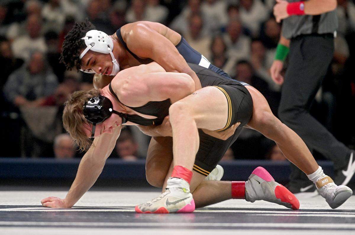 Penn State’s Carter Starocci controls Iowa’s Nelson Brands in the 174 lb bout of the match on Friday, Jan. 27, 2023.