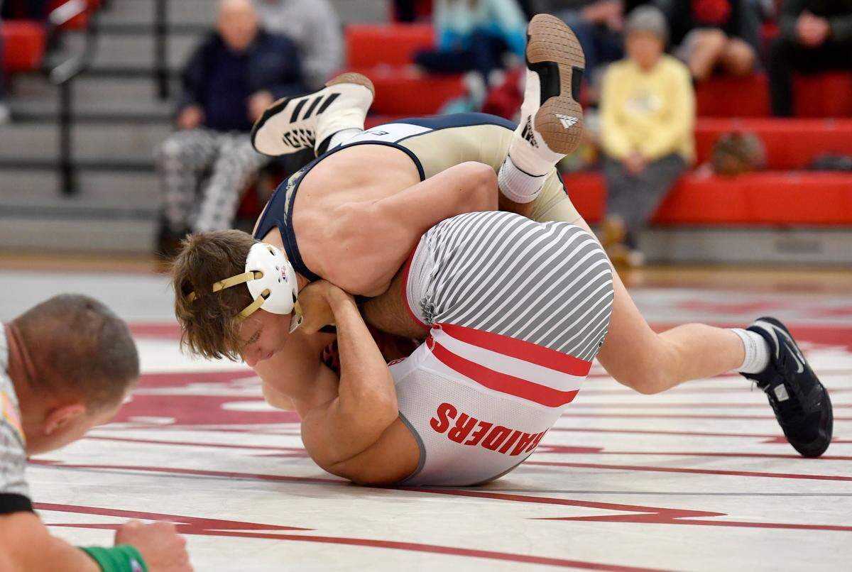 Bald Eagle Area’s Jeffre Pifer rolls Bellefonte’s Alex James to get the pin in the 138 lb bout of the match on Tuesday, Dec. 14, 2021.
