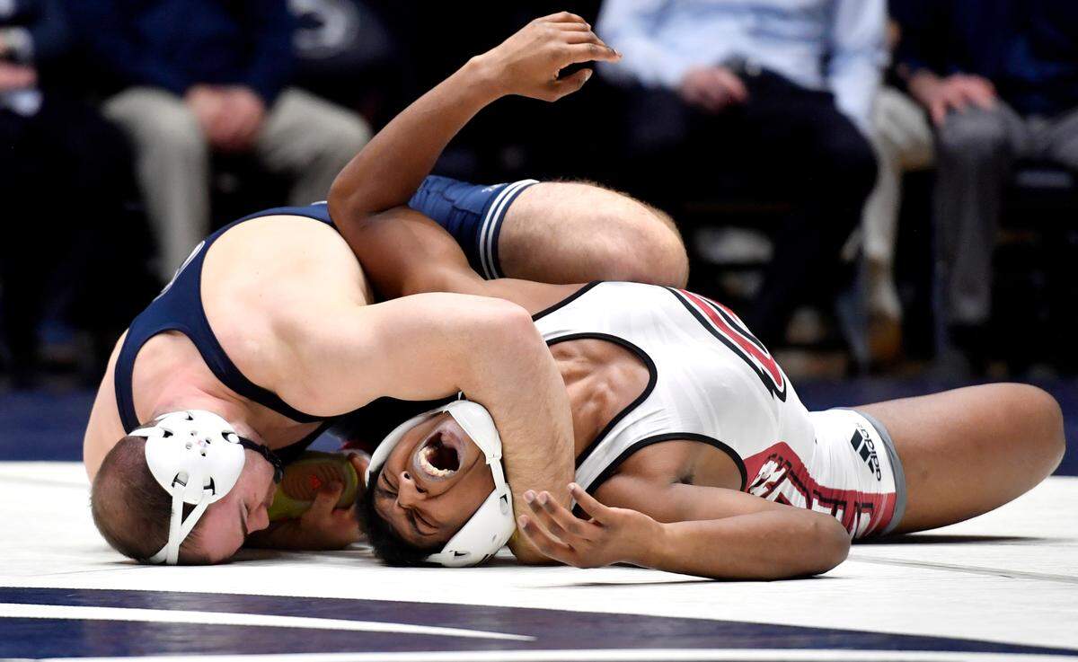 Penn State’s Max Dean pins Rider’s Azeem Bell in the 197 lb bout of the match on Sunday, Feb. 20, 2022.