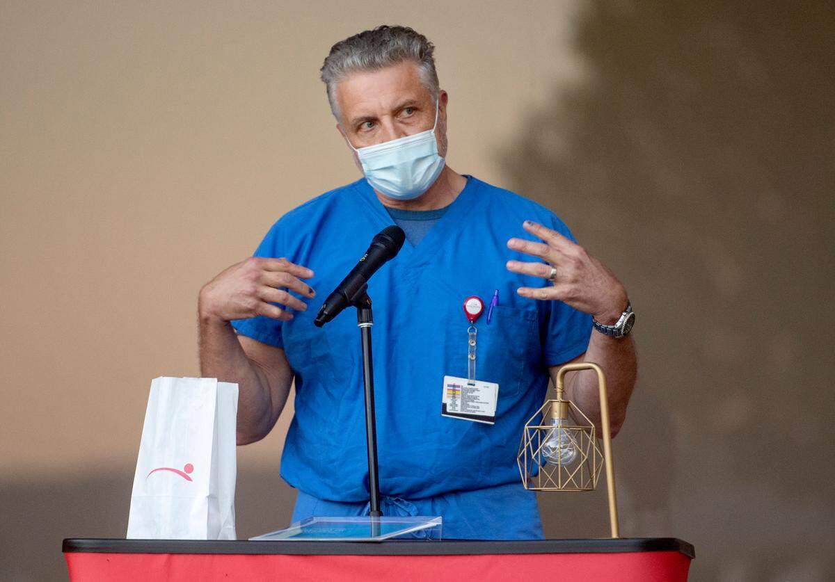 Dr. Thomas Covaleski shares a story of putting on all the PPE at the start of the coronavirus pandemic during Mount Nittany Health’s “Luminary Reflection: An evening of Recognition, Remembrance, Gratitude and Hope,” event on Monday.