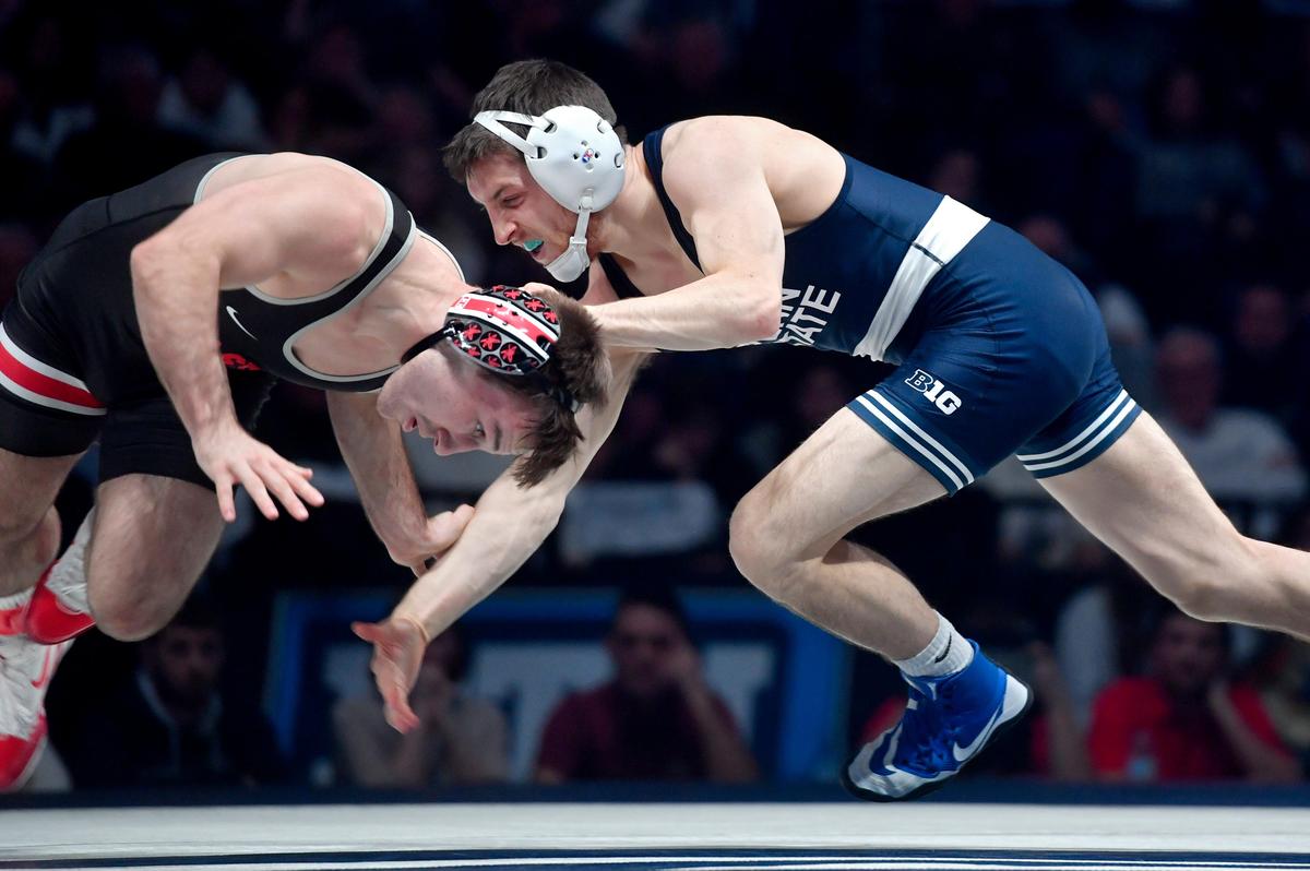 Penn State’s Nick Lee goes for Ohio State’s Luke Pletcher in the 141 lb bout of the duel on Saturday, Feb. 15, 2020 at the Bryce Jordan Center. Lee won by decision, 8-4.