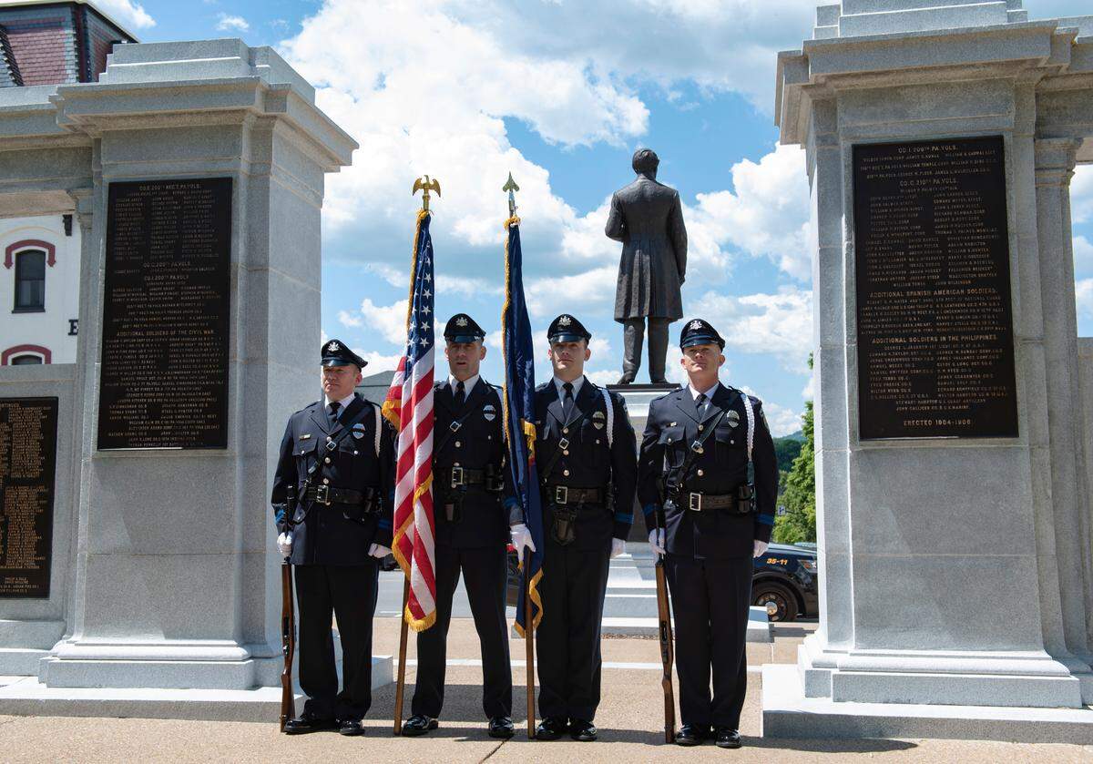 State College police officers attend the annual Centre County Law Enforcement Memorial ceremony at the Centre County Courthouse in Bellefonte on Wednesday.