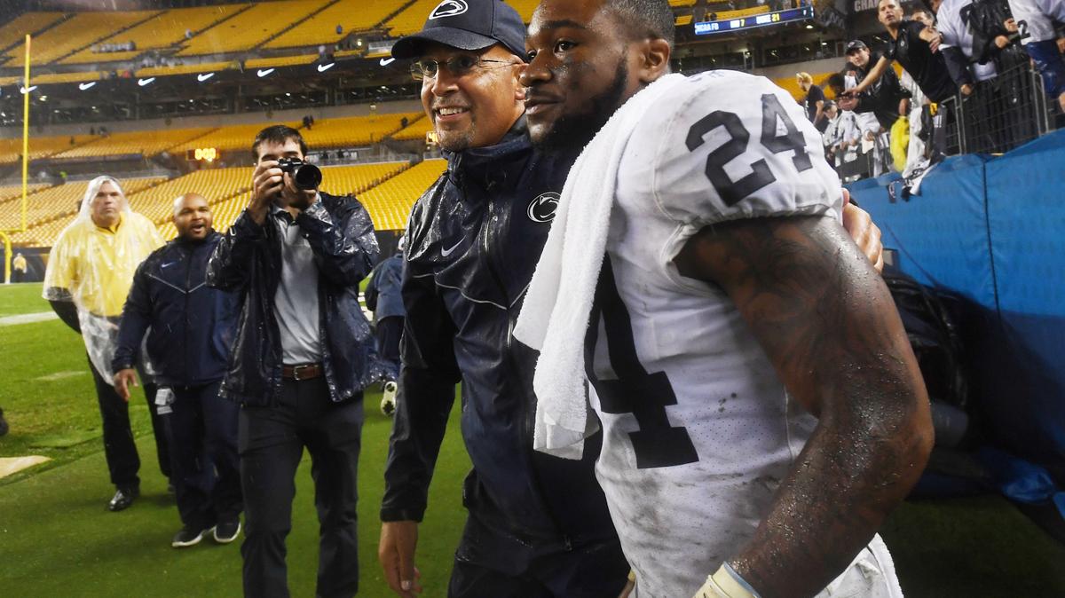 Penn State football coach James Franklin embraces running back Miles Sanders after Penn State’s win over Pitt Saturday, Sept. 8, 2018 at Heinz Field.