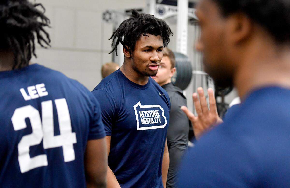 Penn State early enrollee Nick Singleton talk to teammates during a weight lifting session on Thursday, March 3, 2022.