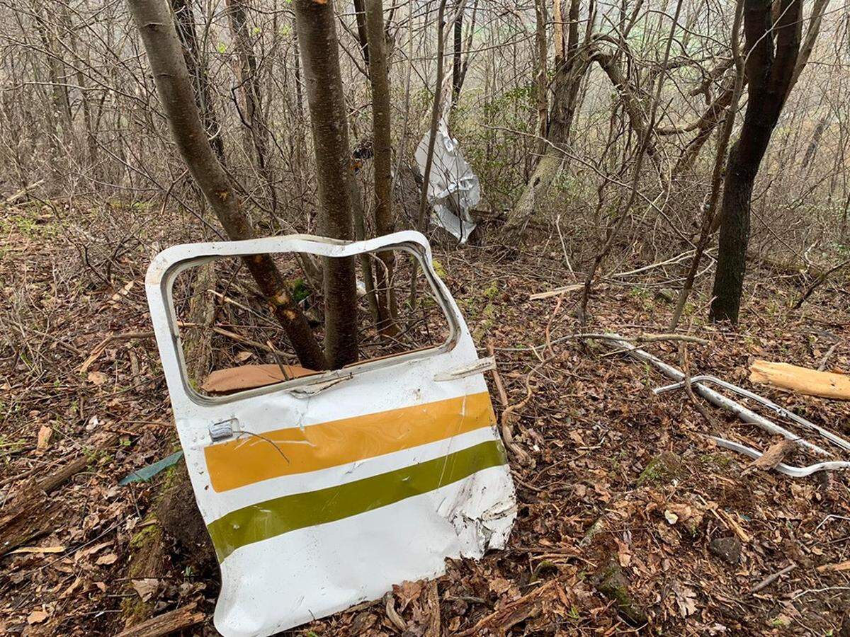 Debris is scattered on the top of Sandy Ridge from a single-engine plane crash Wednesday that claimed the lives of two State College residents.