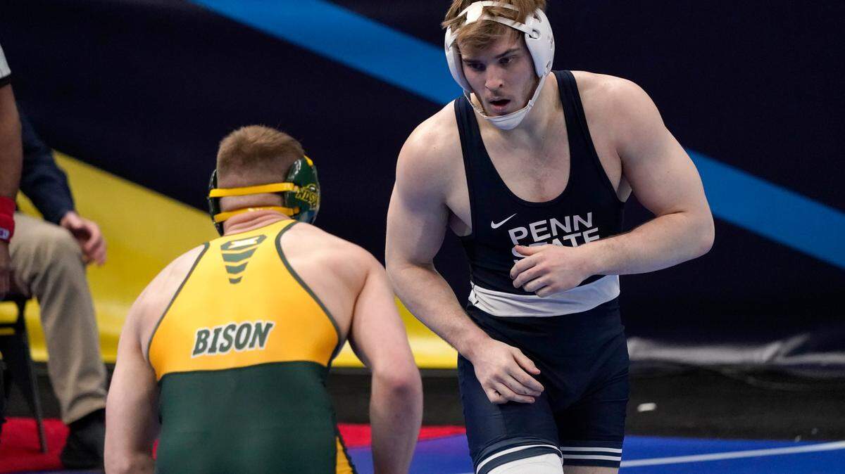 Penn State’s Michael Beard, right, takes on North Dakota State’s Owen Pentz during their 197-pound match in the second round of the NCAA wrestling championships Thursday, March 18, 2021, in St. Louis.