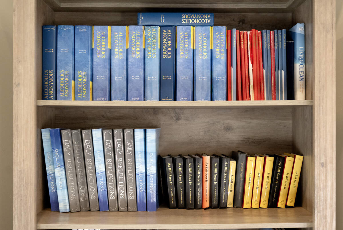 A shelf of Alcoholics Anonymous books and other recovery books at Rule 62 Recovery and Wellness on Wednesday, Oct. 15, 2025.