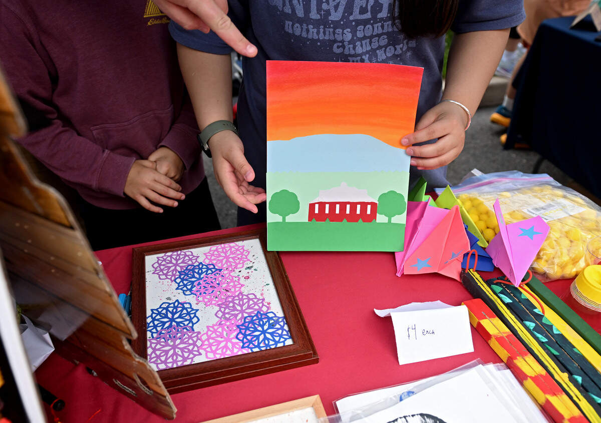 A watercolor and cutout image of the circle barn and Mount Nittany by Owen Seidel, 11, at the Children and Youth Day sidewalk sale on Wednesday, July 8, 2026.