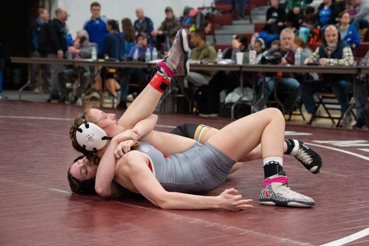Bellefonte's Ella Johnsonbaugh, grey, gets taken down by Curwensville's Brylee London during the District 5-6-9 individual championships in the Altoona High School Fieldhouse in Altoona, Pa., on Saturday, Feb. 21, 2026.