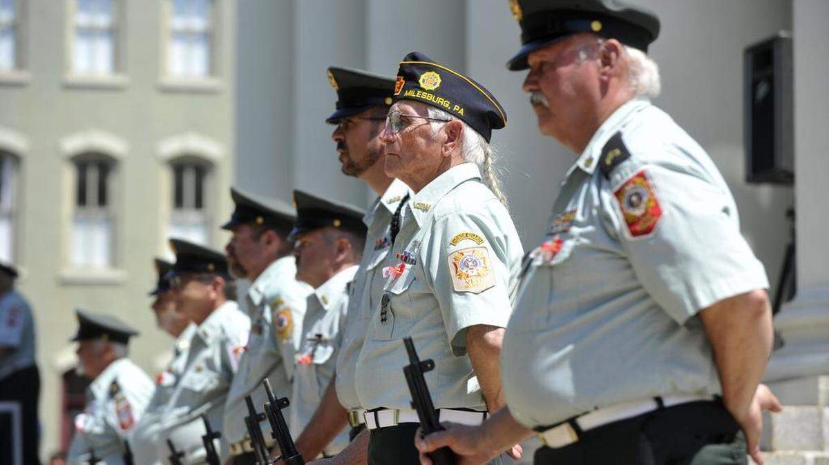 Bill Gentzel stands with other members of the Bellefonte VFW Honor Guard during the Centre County Courthouse Memorial Day service on Monday, May 25, 2015.
