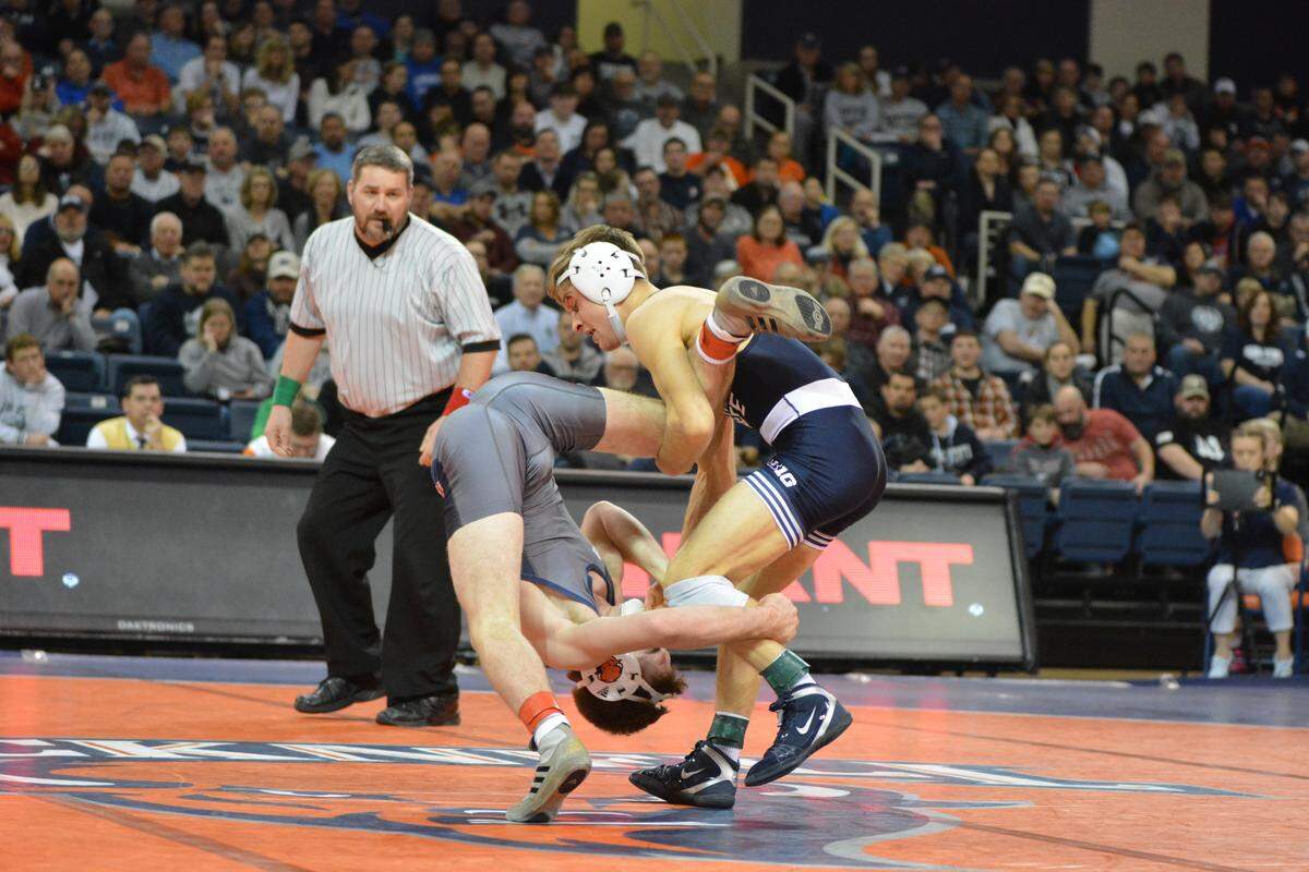 Penn State’s Devin Schnupp and Bucknell’s Geo Barzona scramble for positioning in their 125-pound match of the Nittany Lions’ 42-3 win on Friday night. Schnupp won 5-2 for his first dual-meet victory for Penn State.