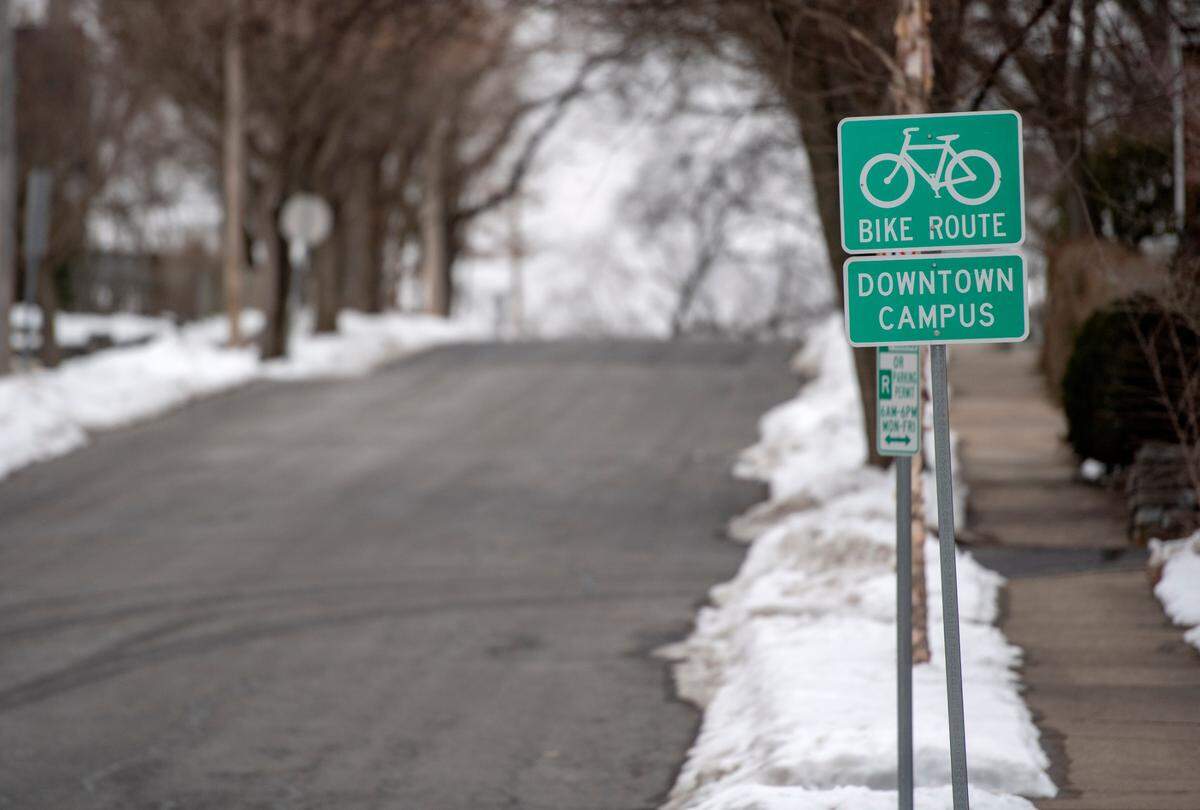 Bike route signs along Gill Street in State College on Feb. 2.