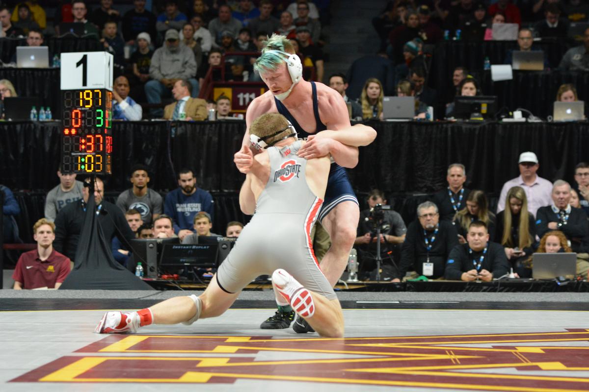 Penn State’s Bo Nickal fights off a shot attempt from Ohio State’s Kollin Moore during their 197-pound finals bout of the Big Ten Championships on Sunday. Nickal won his third conference title with a 10-3 victory