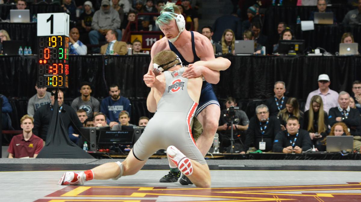 Penn State’s Bo Nickal fights off a shot attempt from Ohio State’s Kollin Moore during their 197-pound finals bout of the Big Ten Championships on Sunday. Nickal won his third conference title with a 10-3 victory